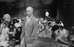 Director Peter Brook surrounded by his cast on the set of the BAM production of the play "The Mahabharata.".