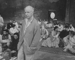 Director Peter Brook surrounded by his cast on the set of the BAM production of the play "The Mahabharata.".