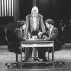 Lyricist Tim Rice (C) with actors Philip Casnoff (L) and David Carroll (R) on the set of the Broadway production of the musical "Chess.".