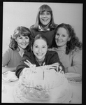 Playwright Beth Henley (C) with actresses (L-R) Mia Dillon, Mary Beth Hurt, Lizbeth Mackay and a birthday cake; from the Broadway production of the play "Crimes Of The Heart.".