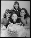 Playwright Beth Henley (C) with actresses (L-R) Mia Dillon, Mary Beth Hurt, Lizbeth Mackay and a birthday cake; from the Broadway production of the play "Crimes Of The Heart.".