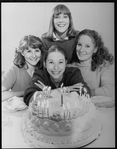 Playwright Beth Henley (C) with actresses (L-R) Mia Dillon, Mary Beth Hurt, Lizbeth Mackay and a birthday cake; from the Broadway production of the play "Crimes Of The Heart.".