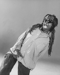 Actress Whoopi Goldberg wearing sunglasses and grabbing her crotch in a scene from the Broadway production of her one-woman show "Whoopi Goldberg.".