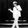 Actress Liza Minnelli in a white suit and fedora performing a number from the Broadway production of the musical "The Act"