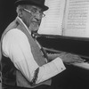 Musical director Luther Henderson at the onstage piano during the Broadway production of the musical "Ain't Misbehavin'.".