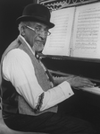 Musical director Luther Henderson at the onstage piano during the Broadway production of the musical "Ain't Misbehavin'.".