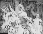 Actress Kate Burton as Alice with man in armor on a horse in a scene from the Broadway revival of the play "Alice In Wonderland.".