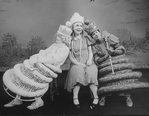 (L-R) Actresses Eva Le Gallienne as the White Queen, Kate Burton as Alice and Mary Louise Wilson as the Red Queen in a scene from the Broadway revival of the play "Alice In Wonderland.".