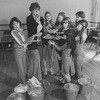 Actress Dorothy Loudon blowing a whistle as she is surrounded by orphan girls incl. Andrea McArdle (L) as Little Orphan Annie during a rehearsal for the Broadway production of the musical "Annie.".