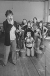 Actress Dorothy Loudon blowing a whistle as she is surrounded by orphan girls incl. Andrea McArdle (2L) as Little Orphan Annie during a rehearsal for the Broadway production of the musical "Annie.".