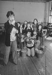 Actress Dorothy Loudon blowing a whistle as she is surrounded by orphan girls incl. Andrea McArdle (2L) as Little Orphan Annie during a rehearsal for the Broadway production of the musical "Annie.".