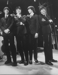 Unidentified actors impersonating Beatles (L-R) John Lennon, Paul McCartney, George Harrison and Ringo Starr in a scene from the Broadway production of the show "Beatlemania.".
