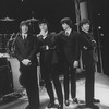 Unidentified actors impersonating Beatles (L-R) John Lennon, Paul McCartney, George Harrison and Ringo Starr in a scene from the Broadway production of the show "Beatlemania."