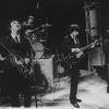 Unidentified actors impersonating Beatles (L-R) Paul McCartney, Ringo Starr, George Harrison and John Lennon in a scene from the Broadway production of the show "Beatlemania."