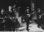 Unidentified actors impersonating Beatles (L-R) Paul McCartney, Ringo Starr, George Harrison and John Lennon in a scene from the Broadway production of the show "Beatlemania."