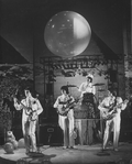 Mitch Weissman as Paul McCartney, Leslie Fradkin as George Harrison, Justin McNeill as Ringo Starr, and Joe Pecorino as John Lennon in a scene from the Broadway stage production Beatlemania