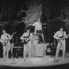 Reed Kailing as Paul McCartney, P. M. Howard as George Harrison, Bobby Taylor as Ringo Starr, and Randy Clark as John Lennon in a scene from the Broadway stage production Beatlemania