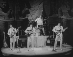 Reed Kailing as Paul McCartney, P. M. Howard as George Harrison, Bobby Taylor as Ringo Starr, and Randy Clark as John Lennon in a scene from the Broadway stage production Beatlemania