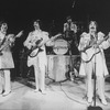Unidentified actors impersonating Beatles (L-R) Paul McCartney, George Harrison, Ringo Starr and John Lennon in a scene from the Broadway production of the show "Beatlemania."