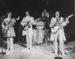 Unidentified actors impersonating Beatles (L-R) Paul McCartney, George Harrison, Ringo Starr and John Lennon in a scene from the Broadway production of the show "Beatlemania."