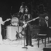 Unidentified actors impersonating Beatles (L-R) John Lennon, Ringo Starr, George Harrison, and Paul McCartney in a scene from the Broadway production of the show "Beatlemania."