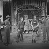 Actors Daniel Jenkins (as Huck Finn) (2L), Bob Gunton (C) and Rene Auberjonois (6R) in a scene from the Broadway production of the musical "Big River"