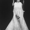 Singer Carrie Smith sitting in a giant swing in a scene from the Broadway production of the musical "Black And Blue"