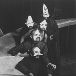 Five unidentified cast members wearing masks in a scene from the Off-Broadway production of the play "The Blacks."