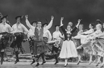 Future choreographer Jerry Mitchell (2L), ice skater John Curry (4L) and dancer Marina Eglevsky (6R) in a scene from the Broadway revival of the musical "Brigadoon"