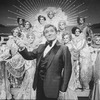 Actor Gene Barry and drag performers in a scene from the Broadway production of the musical "La Cage Aux Folles."