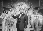 Actor Gene Barry and drag performers in a scene from the Broadway production of the musical "La Cage Aux Folles."