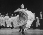 Actress Renee (Zizi) Jeanmaire dancing with others in a scene from the Broadway revival of the musical "Can Can".