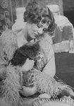 Actress Diana Rigg as French author Colette holding a cat in a scene from the Broadway-bound Seattle, WA production of the musical "Colette"