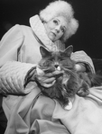 Actress Diana Rigg as French author Colette holding a cat in a scene from the Broadway-bound Seattle, WA production of the musical "Colette"