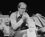 Actor John Lithgow talking on the telephone in a scene from the Broadway production of the play "Division Street"