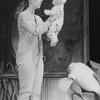 Actress Kate Burton holding a doll in a scene from the Broadway production of the musical "Doonesbury.".