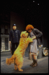 Annie, Sandy and a policeman in a scene from the Toronto production of the musical "Annie."