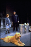 Annie, Sandy and a policeman in a scene from the Toronto production of the musical "Annie."