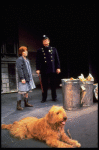 Annie, Sandy and a policeman in a scene from the Toronto production of the musical "Annie."
