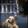 Actress Mary K. Lombardi as Annie and O'Malley as Sandy w. a policeman in a scene from the Detroit production of the musical "Annie."