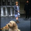 Actress Mary K. Lombardi as Annie and O'Malley as Sandy w. a policeman in a scene from the Detroit production of the musical "Annie."