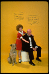Actress Andrea McArdle as Annie w. Sandy and Reid Shelton as Daddy Warbucks w. comic strip balloons above them; from the Broadway production of the musical "Annie."