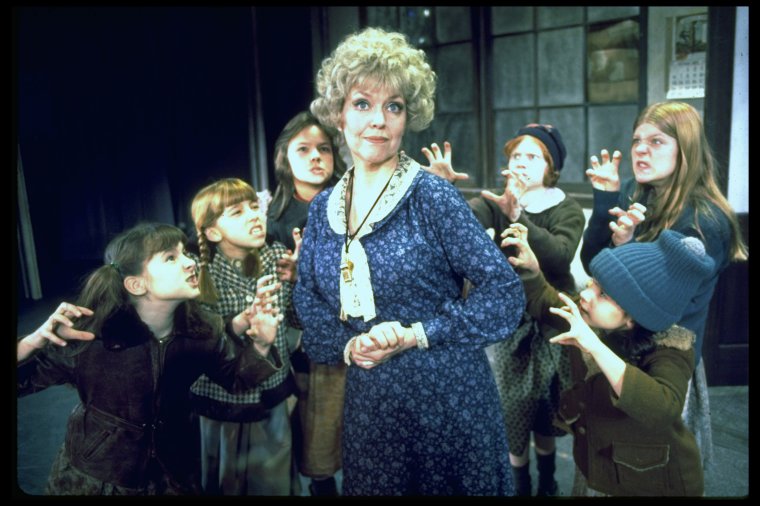 Dorothy Loudon as Miss Hannigan (C) w. orphans incl. Danielle Brisebois ...