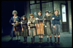 Dorothy Loudon as Miss Hannigan w. orphans incl. Danielle Brisebois in a scene from the Broadway production of the musical "Annie."