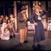 R) Dorothy Loudon as Miss Hannigan w. orphans incl. (3L) Andrea McArdle as Annie and (6L) Danielle Brisebois in a scene from the Broadway musical "Annie."