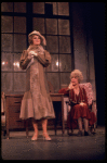 R-L) Actresses Dorothy Loudon as Miss Hannigan and Sandy Faison as Grace in a scene from the Broadway production of the musical "Annie."