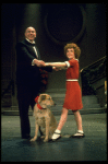 Actors Reid Shelton as Daddy Warbucks and Andrea McArdle as Annie w. Sandy in a scene from the Broadway production of the musical "Annie."