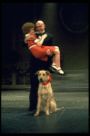 Actors Reid Shelton as Daddy Warbucks and Andrea McArdle as Annie w. Sandy in a scene from the Broadway production of the musical "Annie."