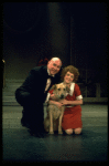 Actors Reid Shelton as Daddy Warbucks and Andrea McArdle as Annie w. Sandy in a scene from the Broadway production of the musical "Annie."