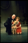 Actors Reid Shelton as Daddy Warbucks and Andrea McArdle as Annie w. Sandy in a scene from the Broadway production of the musical "Annie."